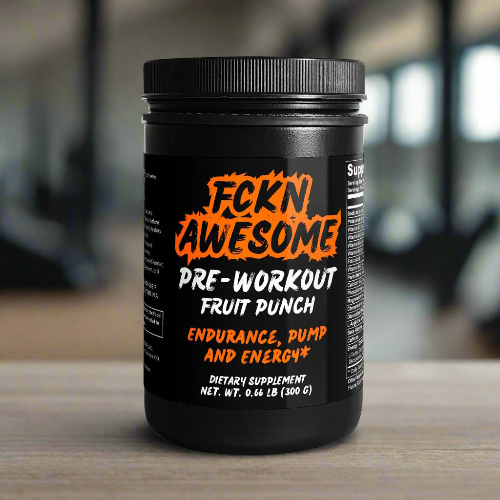 a black can of FCKN AWESOME's pre-workout powder (with fruit taste) on a wooden table in a modern gym